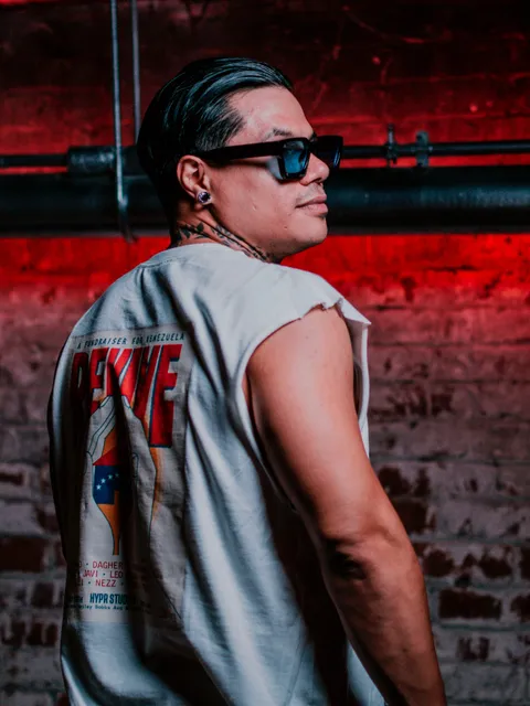 Leo Rojas in red club lighting